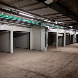 Garage building made of concrete with roller shutter doors